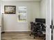 Functional office space with wood floors and a large window for natural light at 10209 Folly Beach Rd, Orlando, FL 32827