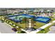 Aerial view of the tennis and pickleball courts surrounded by well-maintained landscaping in a vibrant community at 10209 Folly Beach Rd, Orlando, FL 32827