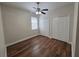 Bedroom with ceiling fan, wood floors, and closet space at 110 Sophia Marie Cv, Sanford, FL 32771