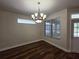 Dining area features wood flooring, modern chandelier, and natural light at 110 Sophia Marie Cv, Sanford, FL 32771