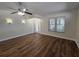 Bright living room with wood floors, ceiling fan, and lots of natural light at 110 Sophia Marie Cv, Sanford, FL 32771