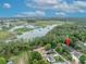 Aerial view of property showcasing its proximity to a lake and surrounding natural beauty at 1130 Roxboro Rd, Longwood, FL 32750