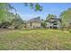 View of the backyard with fencing, boat parking and garden at 1130 Roxboro Rd, Longwood, FL 32750