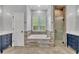 Bathroom featuring a large soaking tub, separate glass shower, and vanity with double sinks at 1130 Roxboro Rd, Longwood, FL 32750