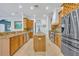 Spacious eat-in kitchen with stainless steel appliances, center island, and wood cabinetry at 1130 Roxboro Rd, Longwood, FL 32750
