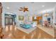 Spacious living area with hardwood floors seamlessly connects to the kitchen and dining space at 1130 Roxboro Rd, Longwood, FL 32750