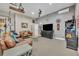 Entertainment room featuring leather couches, large TV, and block wall decor at 1130 Roxboro Rd, Longwood, FL 32750