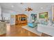 Bright living room with white sofas, decorative blue coffee table and a large wood entertainment center at 1130 Roxboro Rd, Longwood, FL 32750