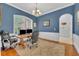 Bright office with shuttered windows, rich blue walls, and stylish chandelier at 1130 Roxboro Rd, Longwood, FL 32750