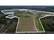 Expansive land parcel with a mix of open fields and natural wetlands, enclosed by a white boundary line at 11320 Montevista Rd, Clermont, FL 34711