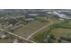 Aerial view of a beautiful acreage property featuring ponds and lush trees at 11320 Montevista Rd, Clermont, FL 34711
