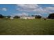 Exterior shot of barn, house, and other structures on the property at 11320 Montevista Rd, Clermont, FL 34711