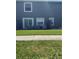 Cozy back patio, perfect for outdoor relaxation and entertaining with a green lawn at 12850 Lexington Summit St, Orlando, FL 32828