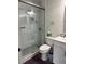 Modern bathroom features a walk-in shower, toilet, and vanity with storage at 12850 Lexington Summit St, Orlando, FL 32828
