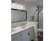Bright bathroom features double vanity, new fixtures, and modern glass enclosed shower at 12850 Lexington Summit St, Orlando, FL 32828
