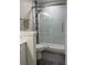 Beautiful bathroom featuring glass enclosed shower with white tile and decorative accents at 12850 Lexington Summit St, Orlando, FL 32828