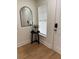Entryway featuring a mirror, side table, and window, creating an inviting and well-lit space at 12850 Lexington Summit St, Orlando, FL 32828