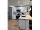 Contemporary kitchen featuring white cabinetry, stainless steel appliances, and ample counter space at 12850 Lexington Summit St, Orlando, FL 32828