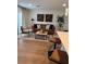 Inviting living room with chic furniture, modern decor, and natural light, perfect for relaxation at 12850 Lexington Summit St, Orlando, FL 32828