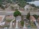 Aerial view of a single-Gathering home showing nearby park with lake and other residential properties at 13 N Observatory Dr, Orlando, FL 32835