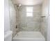Stylish new bathroom featuring tiled shower over tub and tiled surround at 13 N Observatory Dr, Orlando, FL 32835