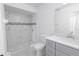 Updated bathroom with tiled walk-in shower and modern vanity at 13 N Observatory Dr, Orlando, FL 32835