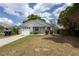 Cozy one-story home with a neat front yard and convenient one-car garage at 13 N Observatory Dr, Orlando, FL 32835