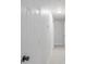 Clean, white hallway with modern lighting and freshly painted walls, offering a welcoming entrance at 13 N Observatory Dr, Orlando, FL 32835