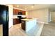 Modern kitchen with dark wood cabinets, updated appliances, and a functional center island at 133 Grove Branch Rd, Winter Haven, FL 33880