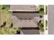 An aerial view reveals the roof, landscaping, driveway, and neighborhood surroundings of the property at 1335 Zeek Ridge St, Clermont, FL 34715