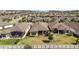 Expansive aerial view of a neighborhood featuring many single-Gathering homes with well-maintained landscaping and backyard spaces at 1335 Zeek Ridge St, Clermont, FL 34715