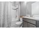 Cozy bathroom with shower and tub combination, classic tile, and a white vanity at 1335 Zeek Ridge St, Clermont, FL 34715