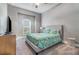 Comfortable bedroom features a ceiling fan, soft carpet, and pleasant natural light at 1335 Zeek Ridge St, Clermont, FL 34715