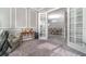Sitting room opens to the dining room with a chandelier and seating for six at 1335 Zeek Ridge St, Clermont, FL 34715