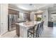Kitchen with granite countertops, stainless steel appliances, and a breakfast bar at 1335 Zeek Ridge St, Clermont, FL 34715
