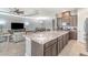 Open-concept kitchen with large island and stainless appliances overlooking the dining and living areas at 1335 Zeek Ridge St, Clermont, FL 34715