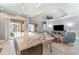 Open floor plan showcasing a kitchen island with granite counters, which is next to the spacious living area at 1335 Zeek Ridge St, Clermont, FL 34715