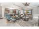 Bright living space featuring tile flooring, comfortable seating, and an open layout connecting to the kitchen at 1335 Zeek Ridge St, Clermont, FL 34715