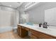 Bathroom featuring a combination shower-tub and vanity with double sinks, offering functionality and comfort at 14556 Unbridled Dr, Orlando, FL 32826