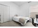 Bright bedroom with a double door closet, plush carpet, and a well-lit window at 14556 Unbridled Dr, Orlando, FL 32826