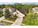 Aerial view of a beautiful, single-Gathering home with mature trees, a driveway and a sidewalk at 14556 Unbridled Dr, Orlando, FL 32826