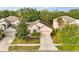 Charming single-Gathering home with a well-manicured lawn, mature trees, and a driveway at 14556 Unbridled Dr, Orlando, FL 32826
