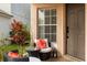 Inviting front porch with stylish furniture and decorative accents, creating a warm welcome at 14556 Unbridled Dr, Orlando, FL 32826