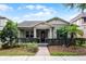 Charming single-story home with manicured landscaping, a brick walkway, and a welcoming front entrance at 14722 Porter Rd, Winter Garden, FL 34787