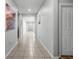Hallway features neutral walls and tiled flooring, illuminated by recessed lighting at 14722 Porter Rd, Winter Garden, FL 34787