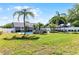 Expansive backyard boasts a pristine pool, two gazebos, and tropical landscaping at 150 Dempsey Way, Orlando, FL 32835