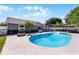 Inviting backyard with pool, fire pit, gazebo and well-maintained landscaping at 150 Dempsey Way, Orlando, FL 32835