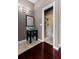 Bathroom with a modern vessel sink, decorative mirror, and a tiled walk-in shower, combining style and functionality at 150 Dempsey Way, Orlando, FL 32835