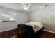 Bedroom with hardwood floors, bed, window and accent wall at 150 Dempsey Way, Orlando, FL 32835