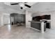 Open-concept living space featuring tile flooring, a breakfast bar, and seamless flow into the dining area at 150 Dempsey Way, Orlando, FL 32835